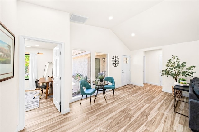 54415 Eisenhower Dr, La Quinta, CA 92253 - sitting room with lofted ceiling, light wood-type flooring, baseboards, and recessed lighting