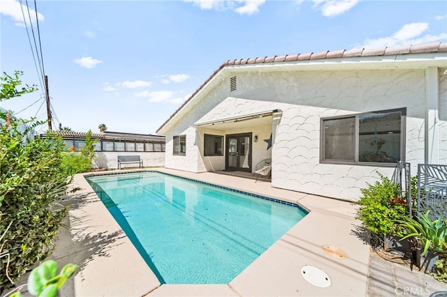 54415 Eisenhower Dr, La Quinta, CA 92253 - view of swimming pool with a patio area and a fenced backyard