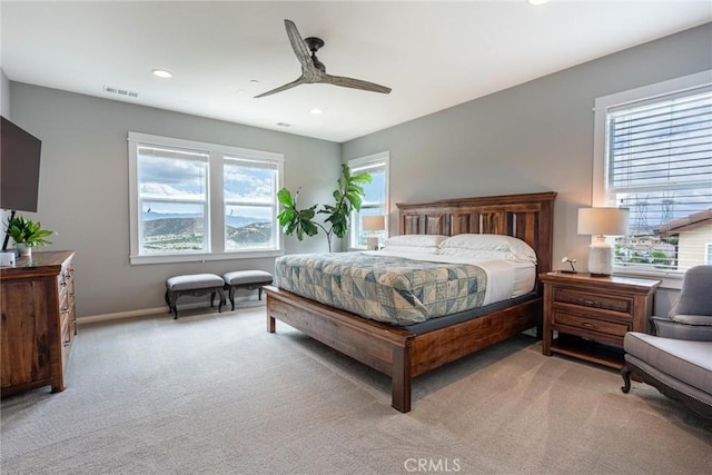 bedroom featuring light colored carpet, recessed lighting, baseboards, and a ceiling fan