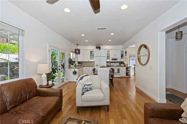 11934 Timber Mountain Ct, Rancho Cucamonga, CA 91739 - living area featuring ceiling fan, light wood-style floors, recessed lighting, and baseboards
