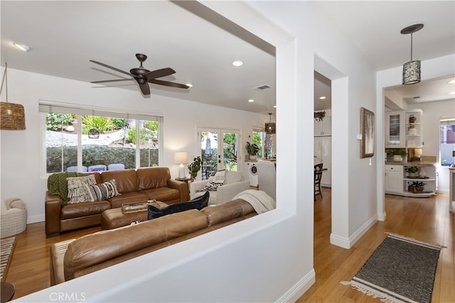 11934 Timber Mountain Ct, Rancho Cucamonga, CA 91739 - living room featuring a ceiling fan, light wood-style flooring, baseboards, and recessed lighting