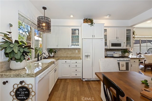 11934 Timber Mountain Ct, Rancho Cucamonga, CA 91739 - kitchen featuring white appliances, a sink, tasteful backsplash, and white cabinets
