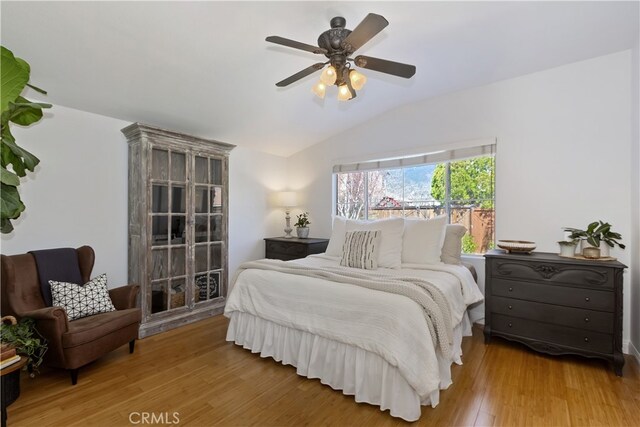 11934 Timber Mountain Ct, Rancho Cucamonga, CA 91739 - bedroom with lofted ceiling, wood finished floors, and a ceiling fan