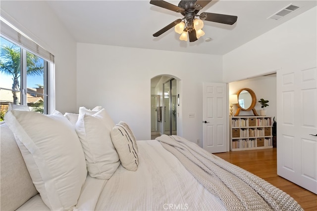 11934 Timber Mountain Ct, Rancho Cucamonga, CA 91739 - bedroom featuring arched walkways, light wood finished floors, a ceiling fan, and ensuite bathroom