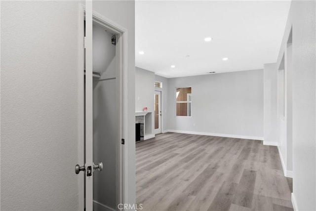 17979 Lost Canyon Rd Unit 104, Canyon Country, CA 91387 - hallway with light wood-style flooring, baseboards, and recessed lighting
