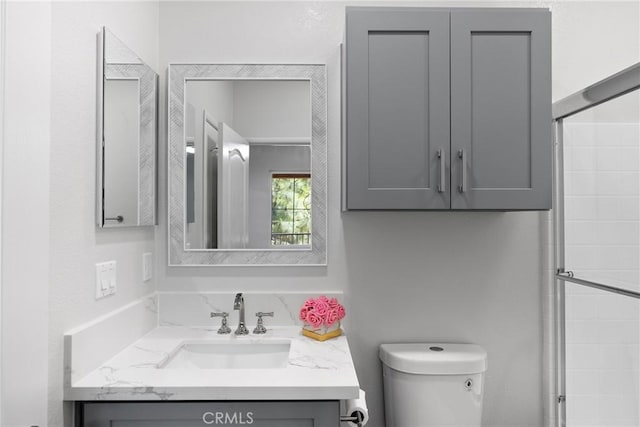 17979 Lost Canyon Rd Unit 104, Canyon Country, CA 91387 - bathroom featuring toilet, vanity, and tiled shower