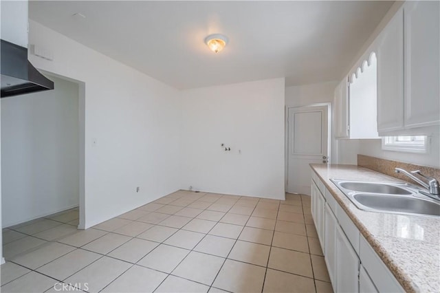 144 W 101st St, Los Angeles, CA 90003 - kitchen featuring a sink, white cabinetry, light countertops, and light tile patterned floors