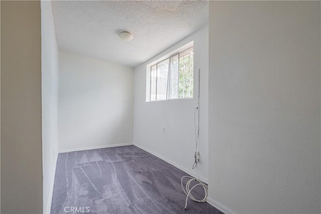 144 W 101st St, Los Angeles, CA 90003 - unfurnished room with carpet, a textured ceiling, and baseboards