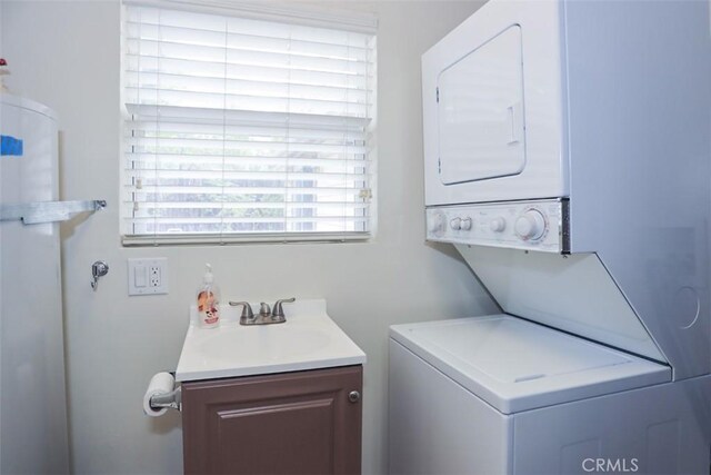 433 Conklin Rd, Big Bear Lake, CA 92315 - clothes washing area with stacked washer and clothes dryer and cabinet space