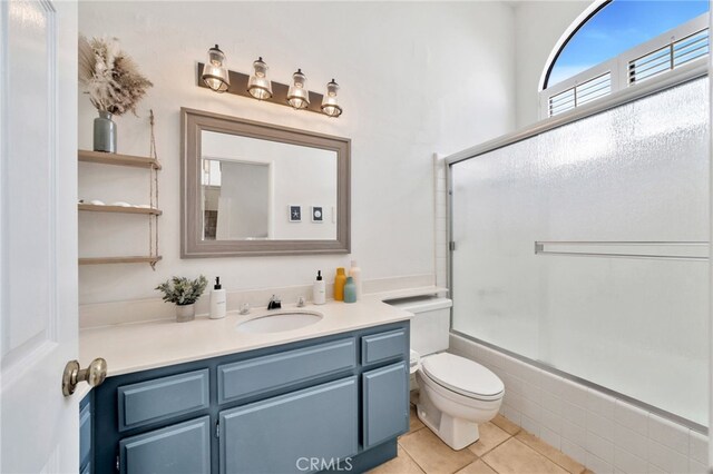 5145 Tortuga Dr Unit 209, Huntington Beach, CA 92649 - full bath with vanity, combined bath / shower with glass door, and tile patterned flooring