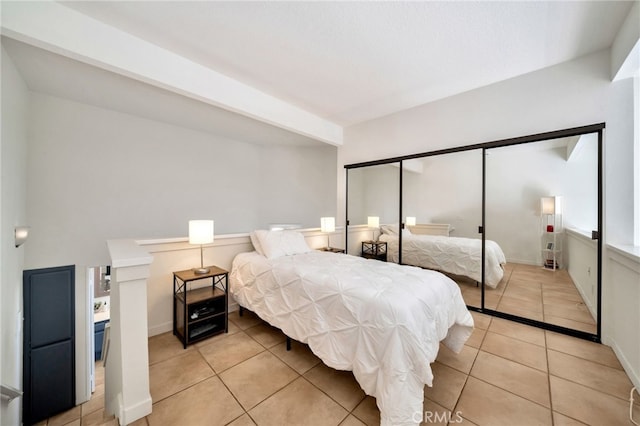 5145 Tortuga Dr Unit 209, Huntington Beach, CA 92649 - bedroom featuring light tile patterned floors and baseboards