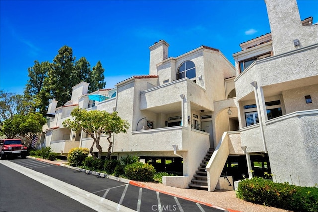 5145 Tortuga Dr Unit 209, Huntington Beach, CA 92649 - view of building exterior featuring stairway