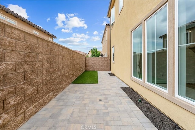 20702 W Chestnut Cir, Porter Ranch, CA 91326 - view of side of property featuring a patio, a fenced backyard, and stucco siding