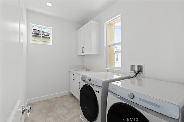20702 W Chestnut Cir, Porter Ranch, CA 91326 - washroom with washer and dryer, cabinet space, plenty of natural light, baseboards, and recessed lighting