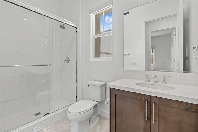 20702 W Chestnut Cir, Porter Ranch, CA 91326 - bathroom with toilet, a stall shower, vanity, and tile patterned floors