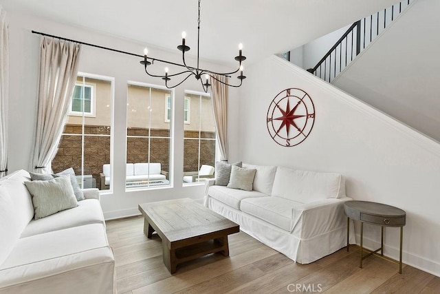 20702 W Chestnut Cir, Porter Ranch, CA 91326 - living area with a chandelier, wood finished floors, and baseboards