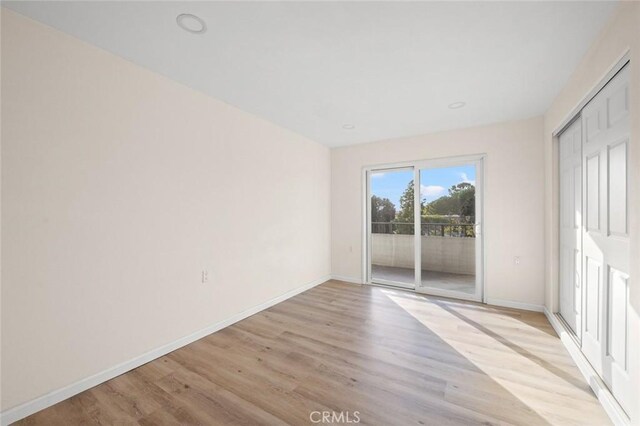 2134 Via Puerta Unit O, Laguna Woods, CA 92637 - spare room featuring light wood finished floors, baseboards, and recessed lighting