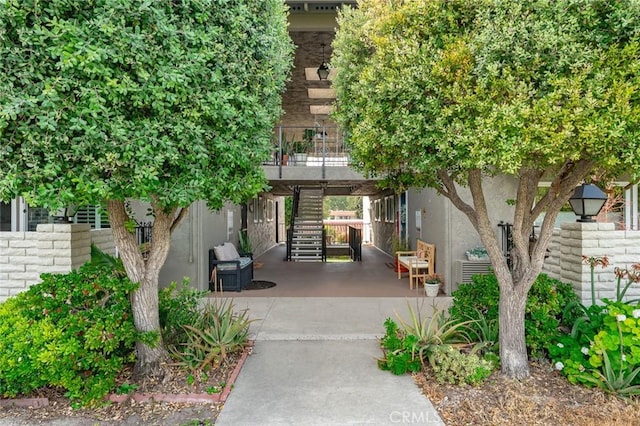 2134 Via Puerta Unit O, Laguna Woods, CA 92637 - surrounding community featuring stairs and a patio