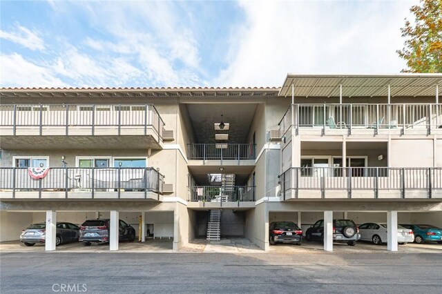 2134 Via Puerta Unit O, Laguna Woods, CA 92637 - view of apartment building / complex with covered parking