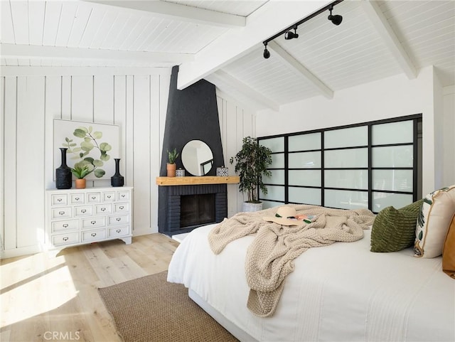 4068 Newton, Torrance, CA 90505 - bedroom featuring wood finished floors, a brick fireplace, and track lighting