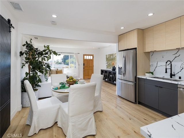 4068 Newton, Torrance, CA 90505 - dining space with a barn door, recessed lighting, and light wood-style floors