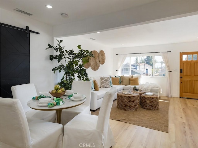 4068 Newton, Torrance, CA 90505 - dining room with light wood-style floors, a barn door, and recessed lighting