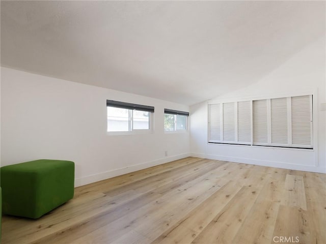 4068 Newton, Torrance, CA 90505 - unfurnished room featuring lofted ceiling, light wood finished floors, and baseboards