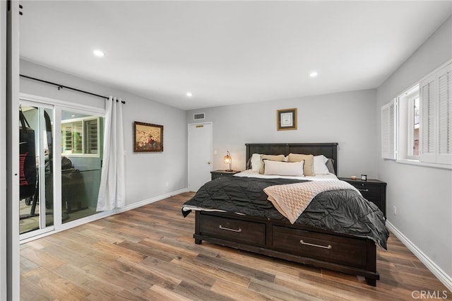 8204 Clemens Ave, West Hills, CA 91304 - bedroom with wood finished floors, recessed lighting, and access to exterior