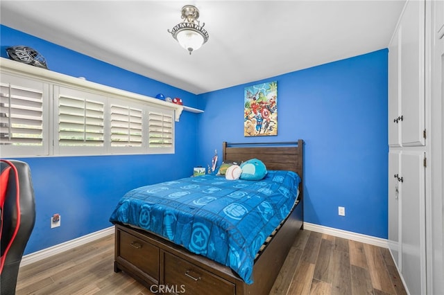 8204 Clemens Ave, West Hills, CA 91304 - bedroom with baseboards and wood finished floors