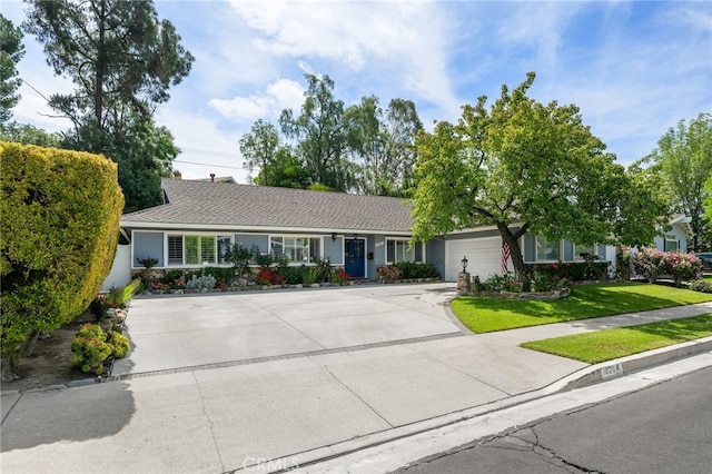 8204 Clemens Ave, West Hills, CA 91304 - ranch-style house with concrete driveway, a garage, a front yard, and stucco siding