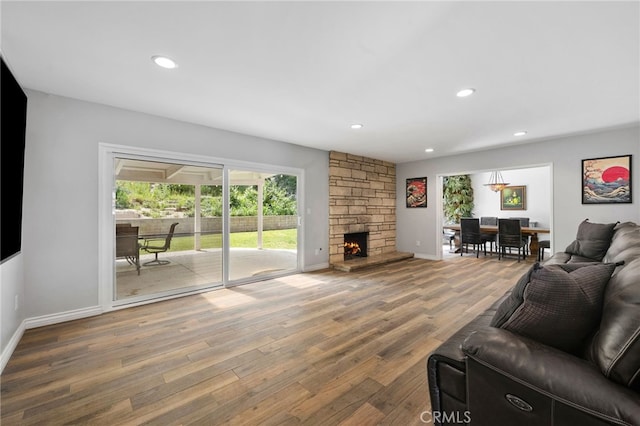8204 Clemens Ave, West Hills, CA 91304 - living area featuring wood finished floors, a fireplace, and recessed lighting