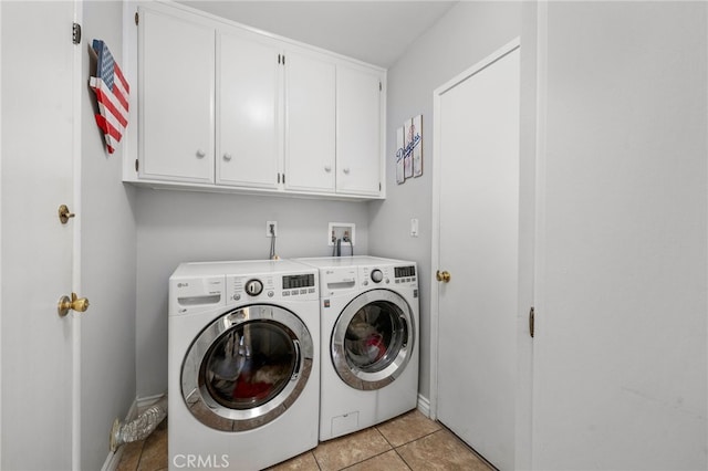 8204 Clemens Ave, West Hills, CA 91304 - laundry room with cabinet space, washer and clothes dryer, and light tile patterned floors
