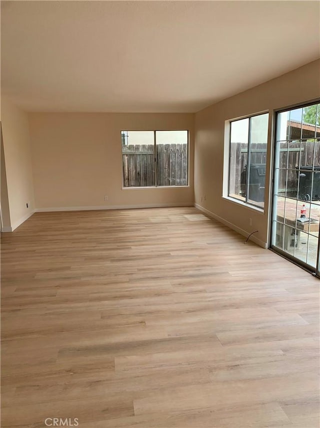 8818 Keremeos Way, San Diego, CA 92126 - unfurnished room with baseboards and light wood-type flooring