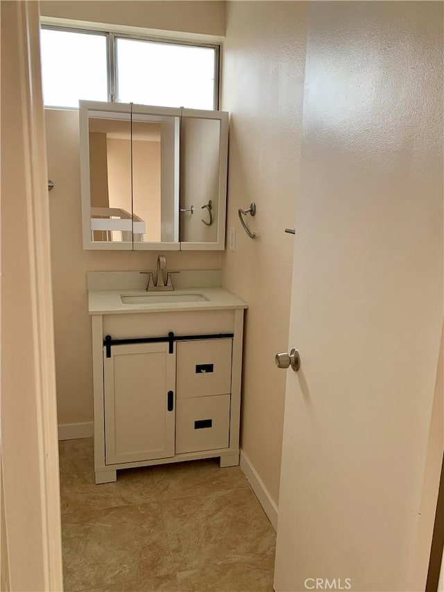 8818 Keremeos Way, San Diego, CA 92126 - bathroom featuring vanity and baseboards
