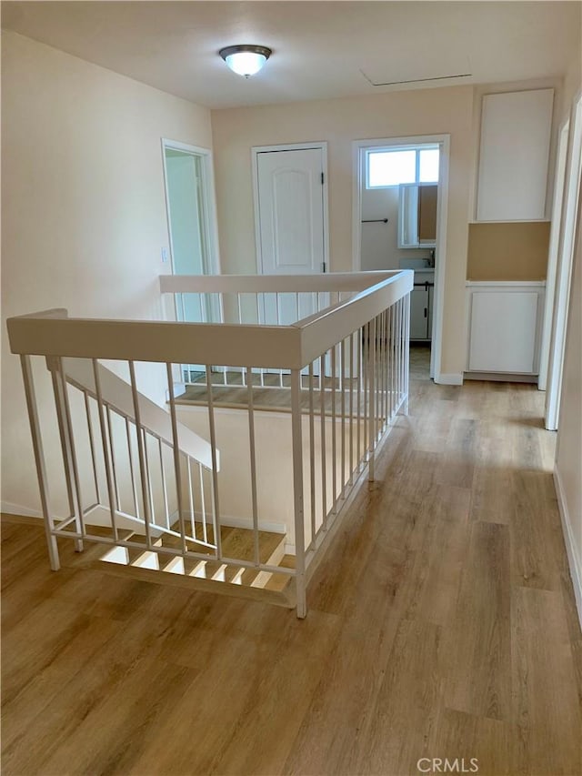 8818 Keremeos Way, San Diego, CA 92126 - hall featuring an upstairs landing, light wood-style flooring, and baseboards