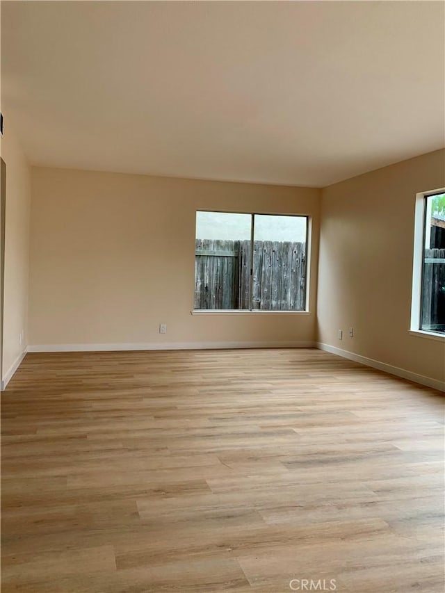 8818 Keremeos Way, San Diego, CA 92126 - spare room with light wood-style floors and baseboards