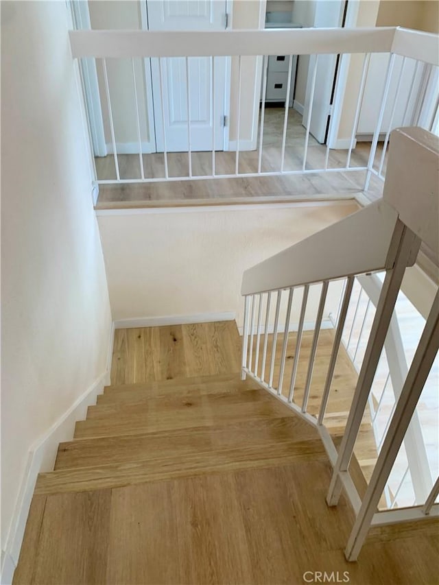 8818 Keremeos Way, San Diego, CA 92126 - staircase with wood finished floors