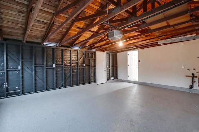 6548 Bantam Lake Cir, San Diego, CA 92119 - garage with baseboards and a garage door opener