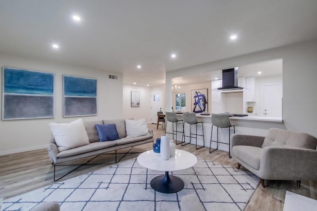 6548 Bantam Lake Cir, San Diego, CA 92119 - living area with light wood finished floors, recessed lighting, and baseboards