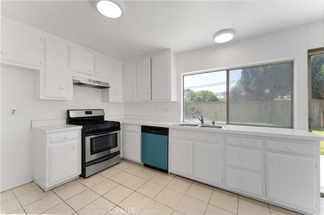 942 E Denwall Dr, Carson, CA 90746 - kitchen with stainless steel range with gas stovetop, dishwashing machine, a sink, under cabinet range hood, and light countertops