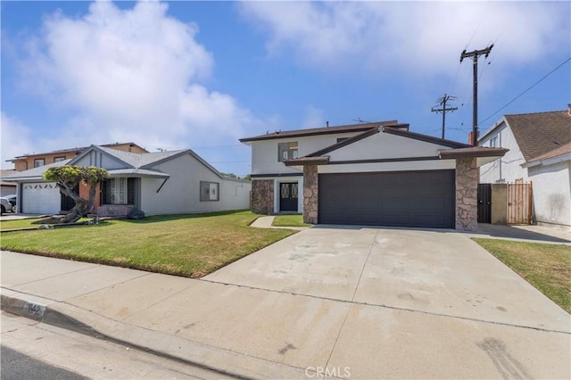 942 E Denwall Dr, Carson, CA 90746 - view of front facade with an attached garage, a front lawn, driveway, stucco siding, and stone siding