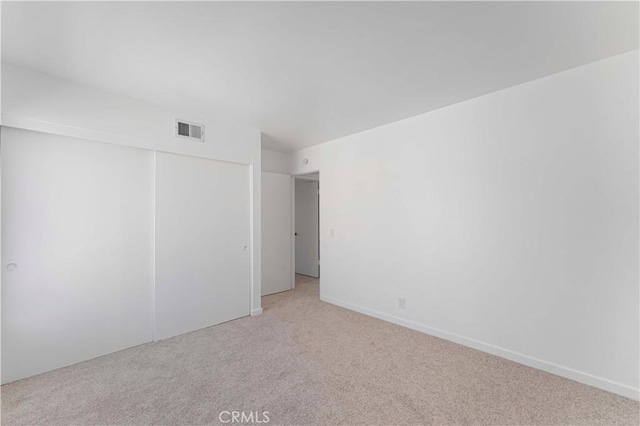 942 E Denwall Dr, Carson, CA 90746 - unfurnished bedroom featuring light carpet and a closet