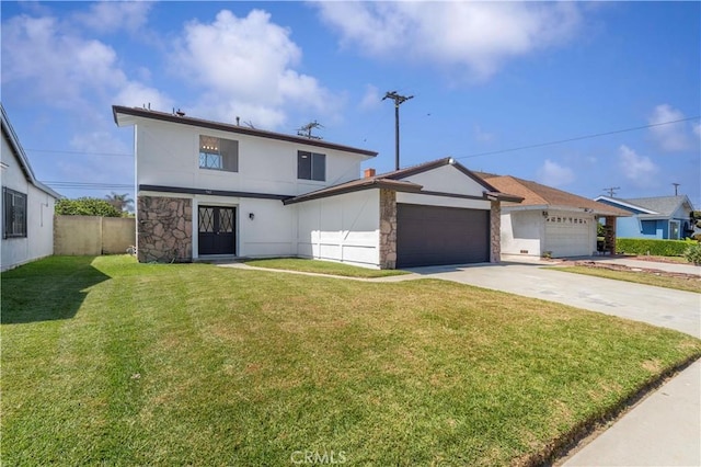 942 E Denwall Dr, Carson, CA 90746 - view of front facade featuring a garage, driveway, stone siding, and stucco siding
