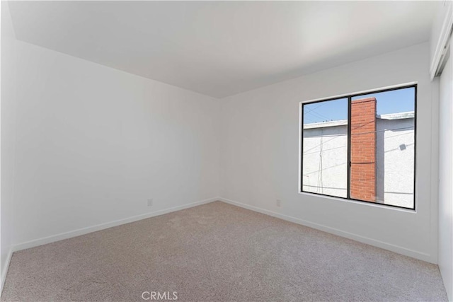 942 E Denwall Dr, Carson, CA 90746 - carpeted spare room with baseboards