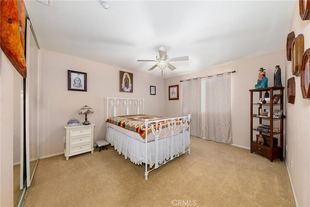 6122 Glen Abbey Pl, Fontana, CA 92336 - bedroom featuring light colored carpet, baseboards, and a ceiling fan