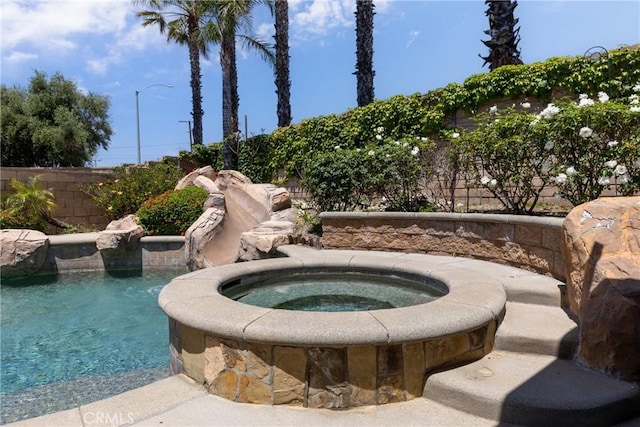 6122 Glen Abbey Pl, Fontana, CA 92336 - view of swimming pool with an in-ground hot tub and fence