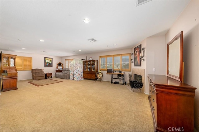 6122 Glen Abbey Pl, Fontana, CA 92336 - living room with light colored carpet, recessed lighting, and a tiled fireplace