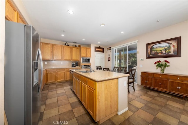 6122 Glen Abbey Pl, Fontana, CA 92336 - kitchen with stainless steel appliances, a sink, a kitchen island with sink, decorative backsplash, and recessed lighting