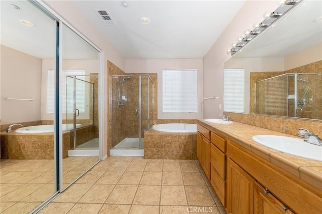 6122 Glen Abbey Pl, Fontana, CA 92336 - bathroom featuring a stall shower, double vanity, and a bath