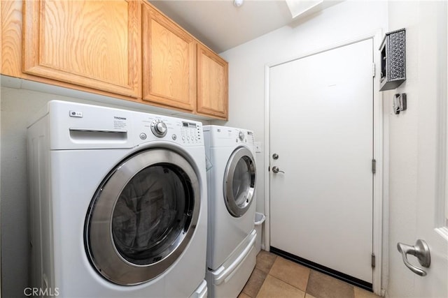 6122 Glen Abbey Pl, Fontana, CA 92336 - laundry area featuring independent washer and dryer, cabinet space, and light tile patterned floors